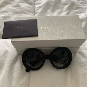 Prada baroque round black sunglasses.